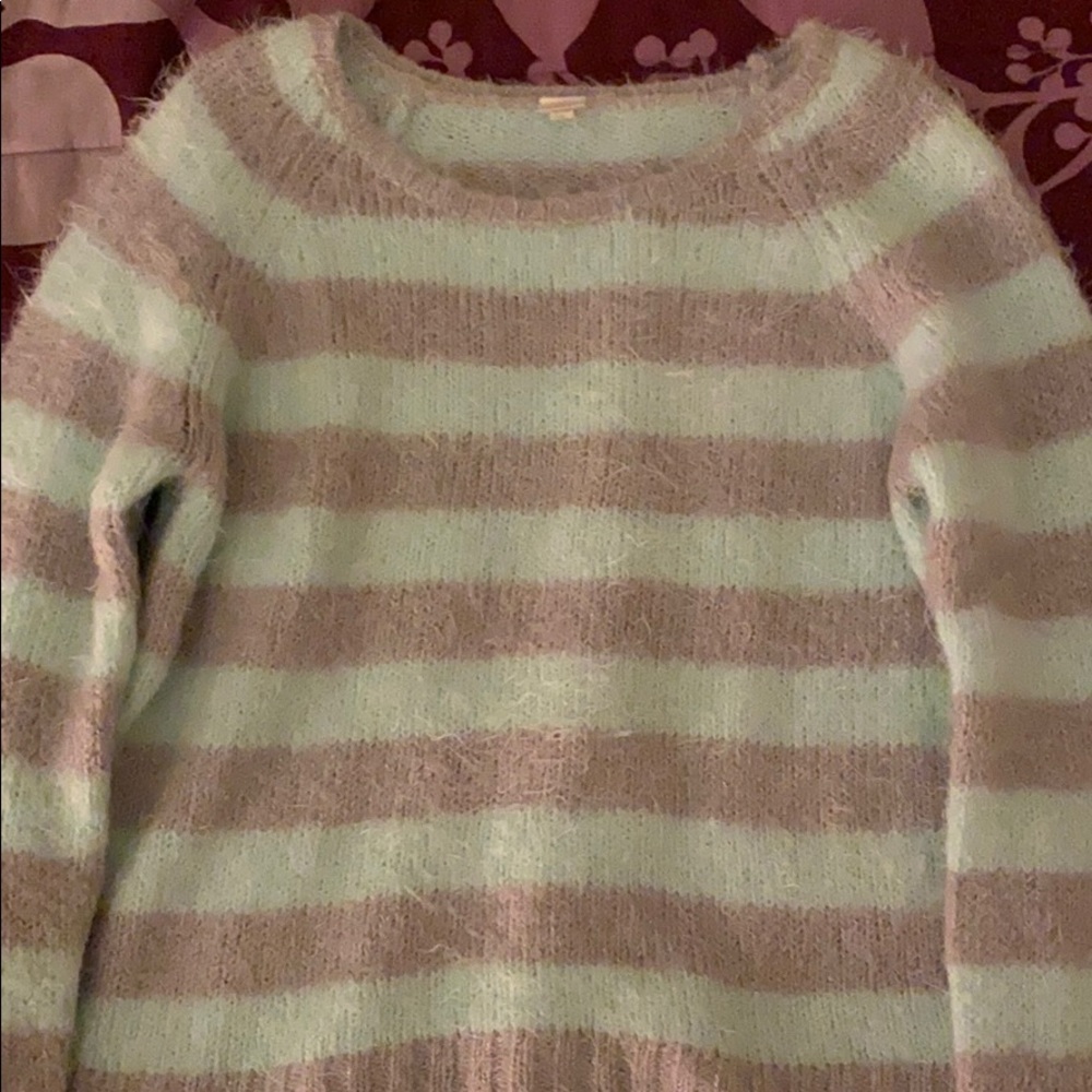 A striped mint green and light grey sweater